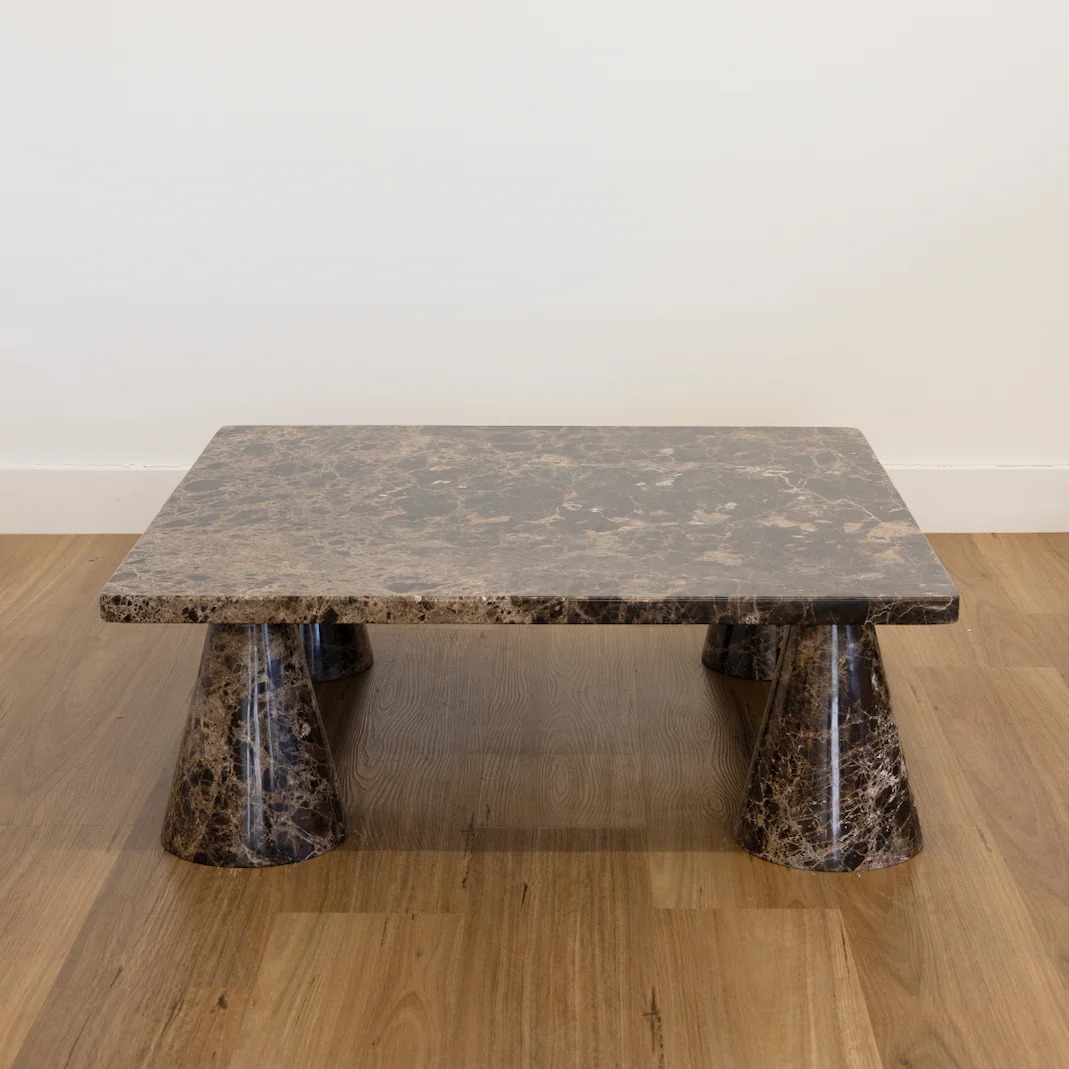 Dark brown marble coffee table with sculptural flared bases
