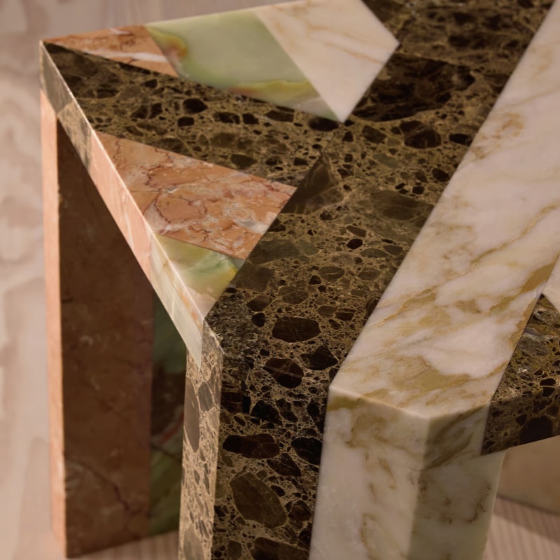 Close-up of multi-marble mosaic side table texture - travertine onyx stone mix detail