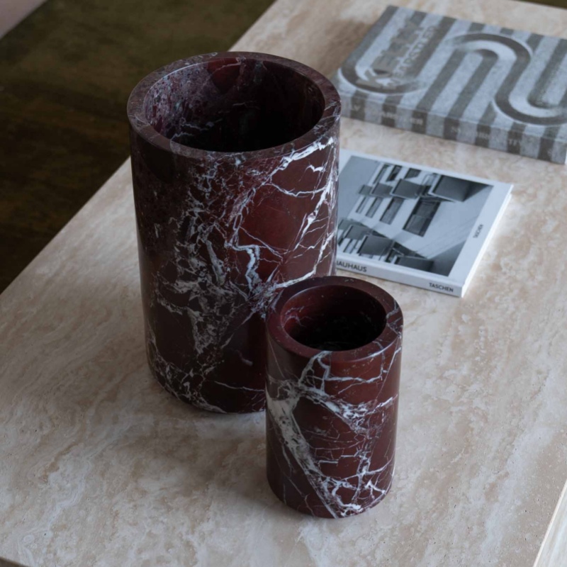 Close-up of Rosso Levanto Marble Cylindrical Vase Set - natural white veined stone texture