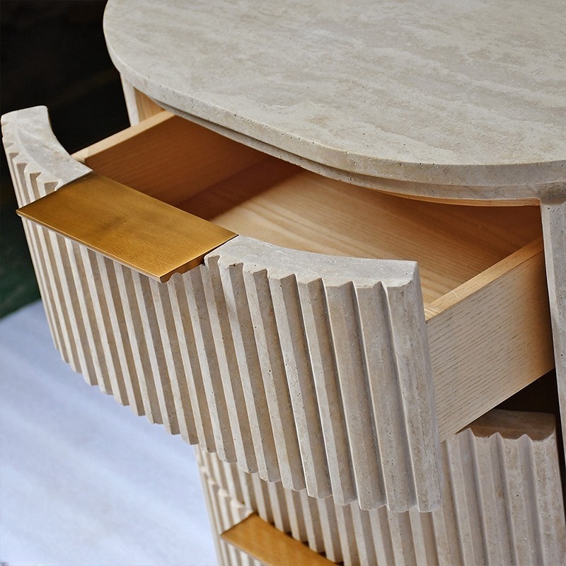Open travertine nightstand drawer - wooden interior and fluted stone exterior detail