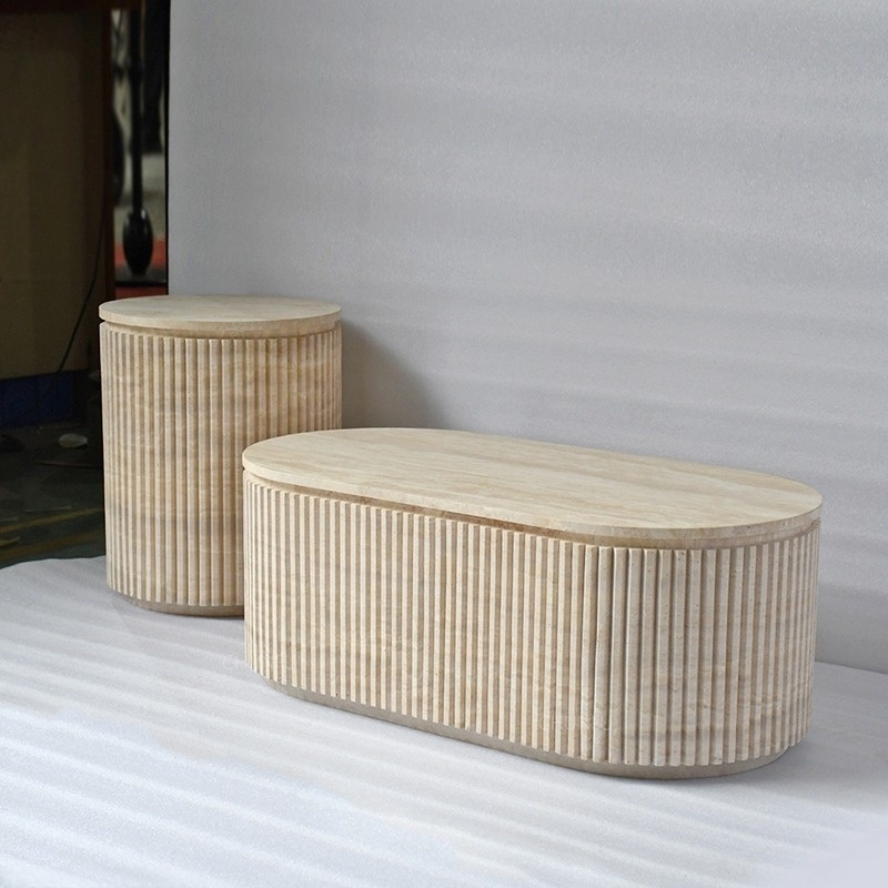 Fluted travertine coffee table set styled in living room with beige sofa and rug